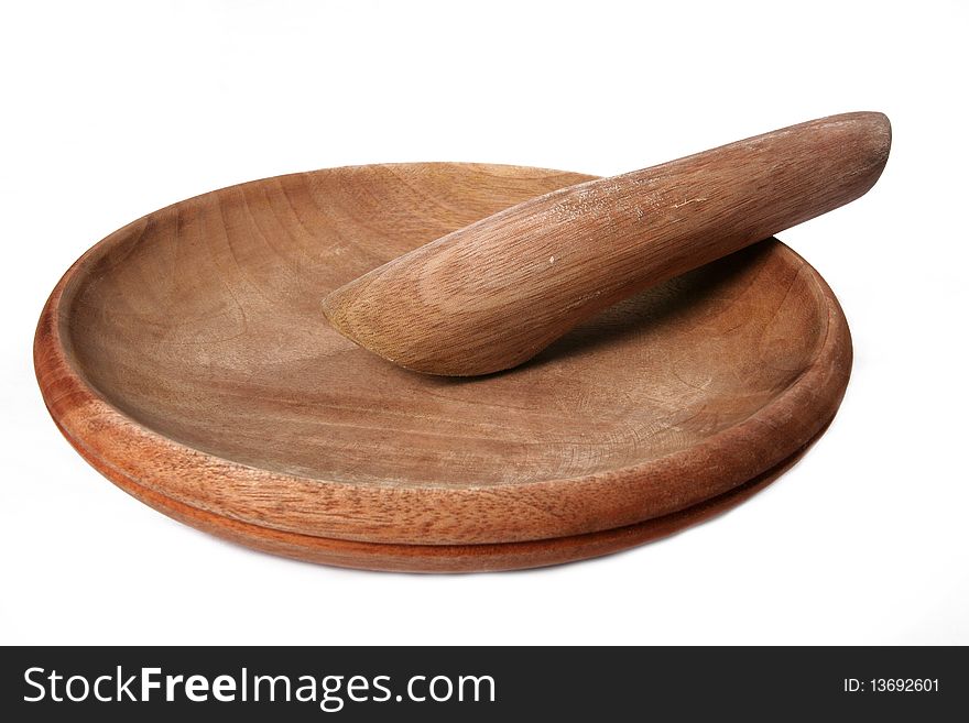 Wooden pestle and mortal traditionally used to grind chilies and herbs for cooking ingredients. Wooden pestle and mortal traditionally used to grind chilies and herbs for cooking ingredients.