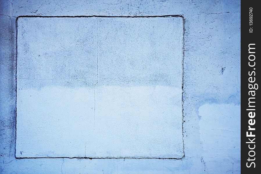 Background detail of blue wall with cracks