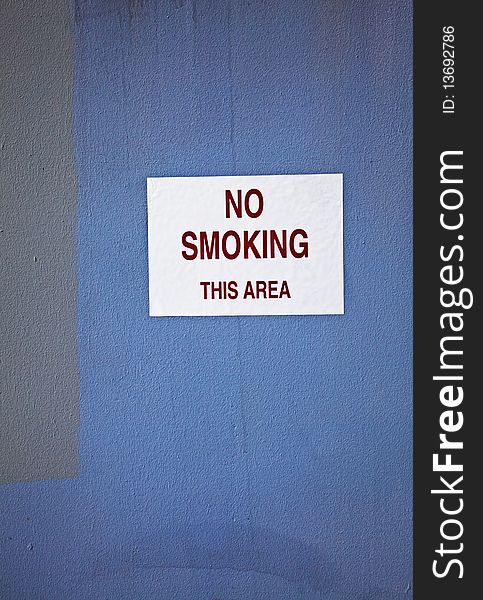 No smoking sign mounted near business area