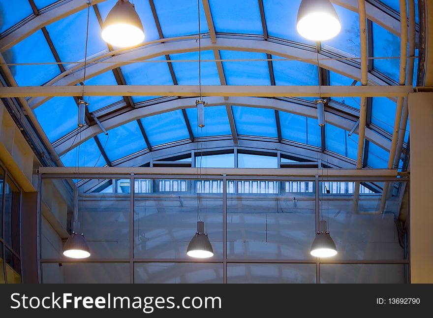 Semicircular roof of dark blue glass and lighting on it. Semicircular roof of dark blue glass and lighting on it.