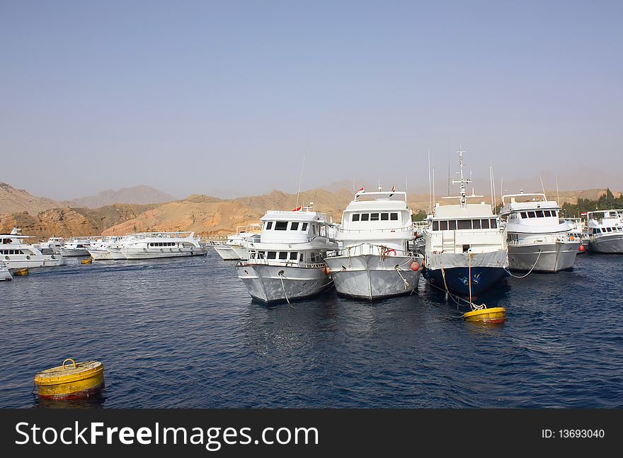 Boats are docked in the seaport of Egypt. Boats are docked in the seaport of Egypt.