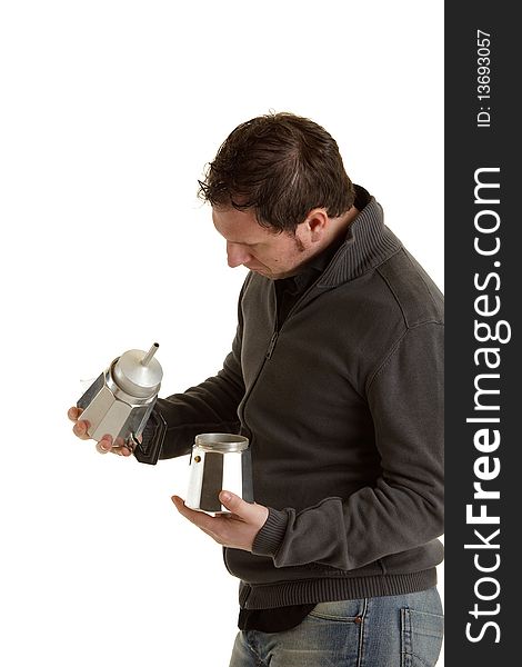 Man is trying to understanding the italian Mocca machine. Man is trying to understanding the italian Mocca machine