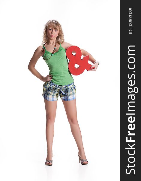 Young blonde woman in fashionable clothing on isolated studio baclground