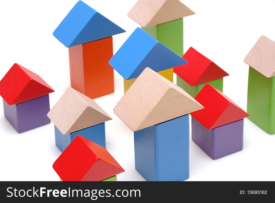 Isolated houses, build by wooden toy blocks.