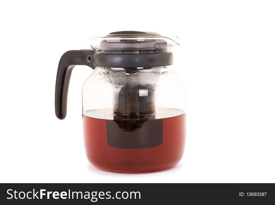 Series. A glass teapot isolated on a white background. Black tea