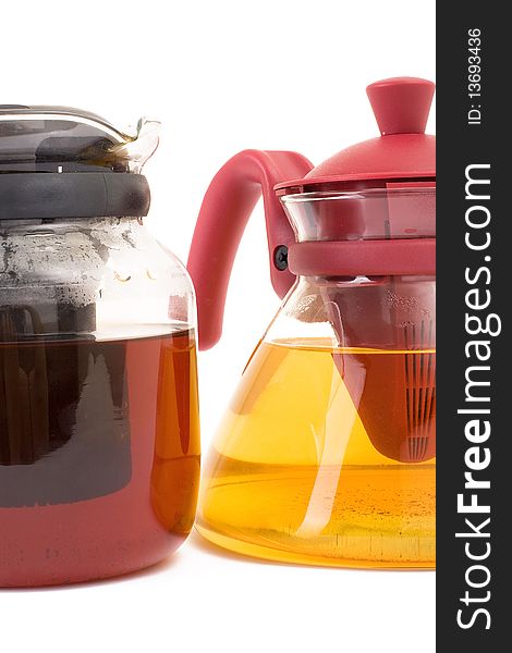 Series. A glass teapot isolated on a white background. Green and black tea