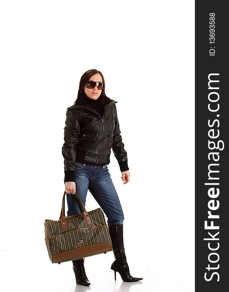 Girl with leather jacket and sunglasses holding a bag. Girl with leather jacket and sunglasses holding a bag