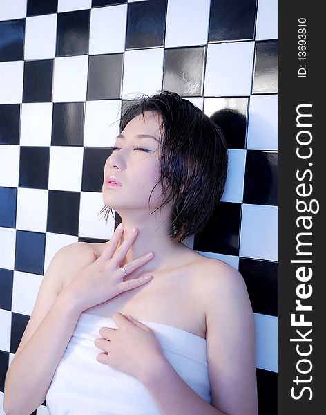 Asian Girl On Checkered Background