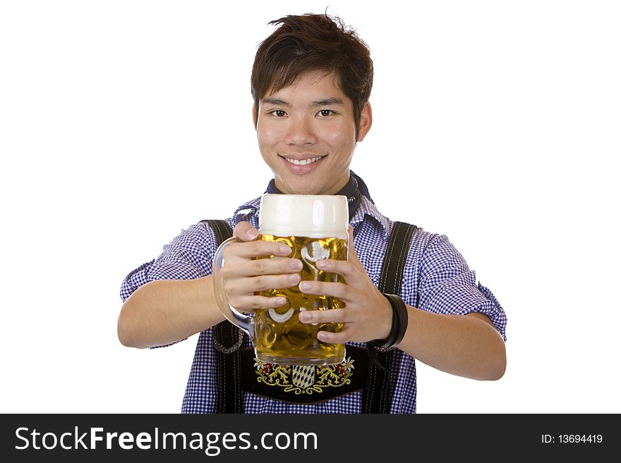 Asian man holding an Oktoberfest beer stein into camera and smiles happy. Isolated on white. Asian man holding an Oktoberfest beer stein into camera and smiles happy. Isolated on white.