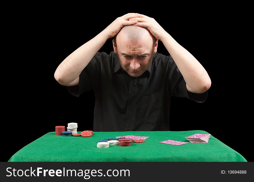 Poker gambler in black shirt.  Losings. Isolated over black