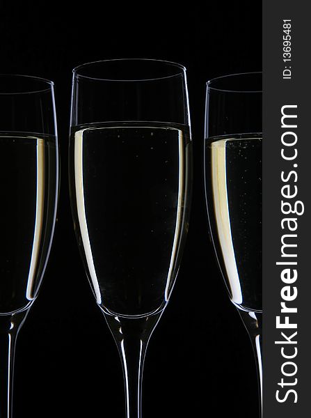 Champagne glasses on black with drink shape. Champagne glasses on black with drink shape