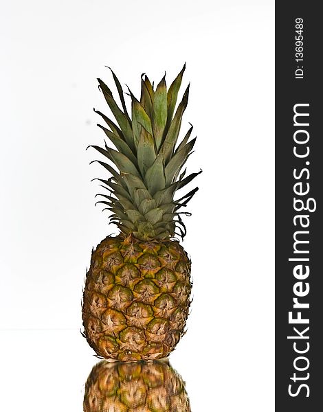 Pineapple with reflection on white for clip art