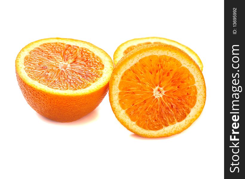 Slice of orange  on white background macro