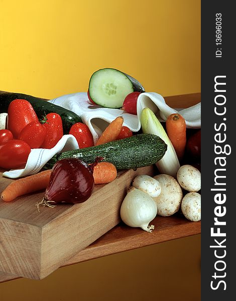 Uncooked mixed vegetables on chopping board