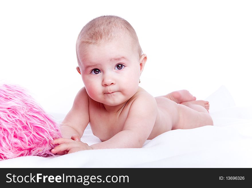 Beautiful baby with pink pillow on white background