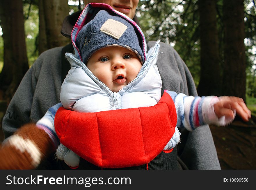 Autumn walk in the mountains with a child in a baby sling. Autumn walk in the mountains with a child in a baby sling