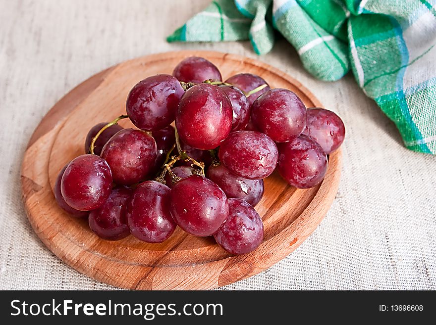 Grapes On Wooden Plate