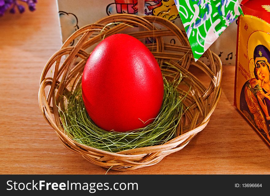 Red Easter egg in a basket. Red Easter egg in a basket.