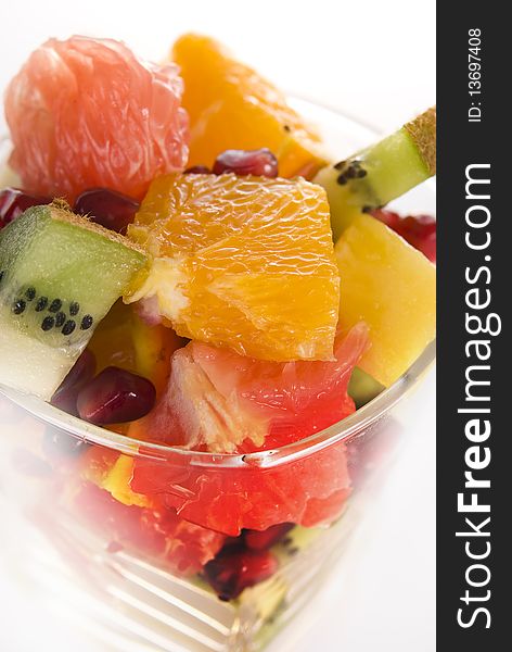 Set of different pieces fresh fruits in glass