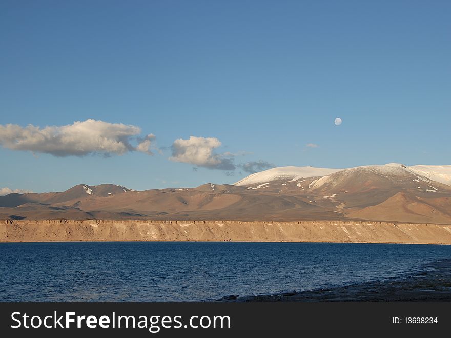 Moon in sky of Laguna verde, Atacama, chile