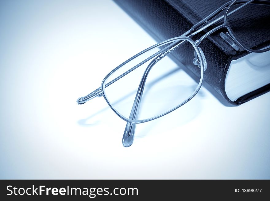 Closeup of book and glasses