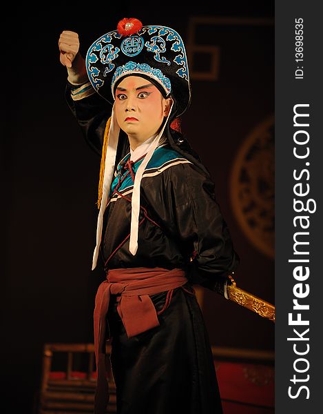 China opera actor with hat and sword.