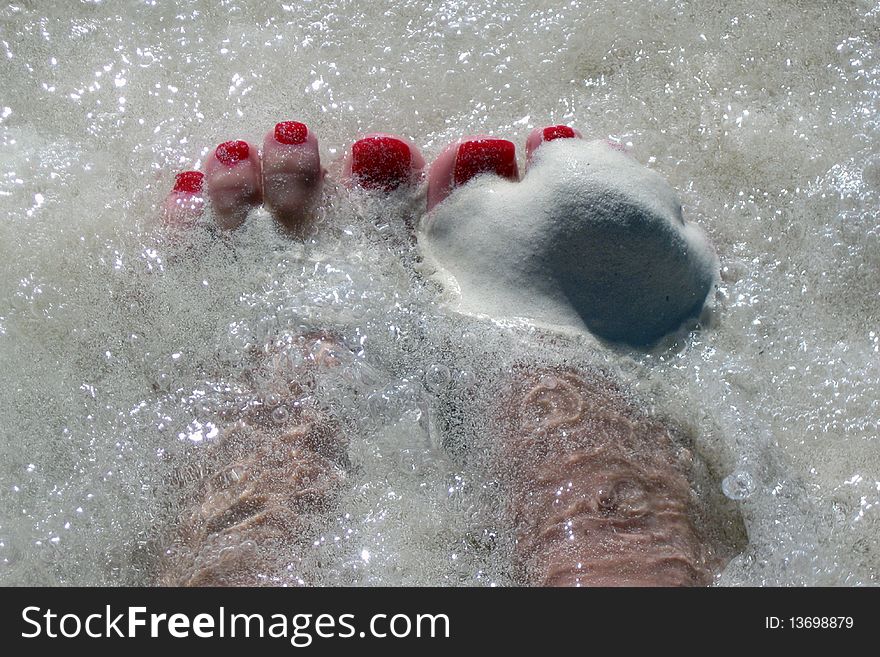 Feet Deep In Sand And Water