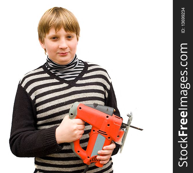 Boy with a fret saw on a white background. Boy with a fret saw on a white background