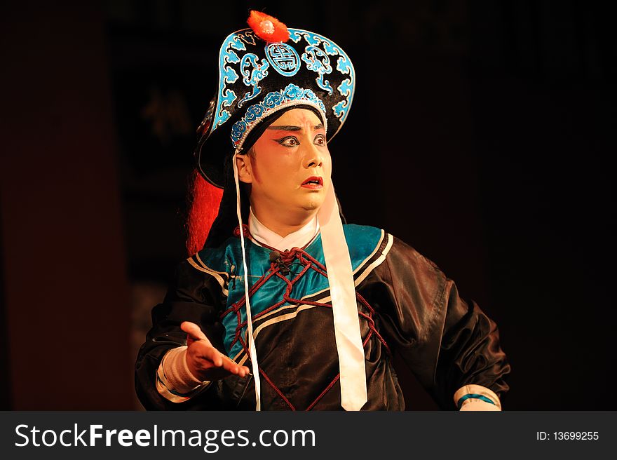 China opera actor with hat and sword.
