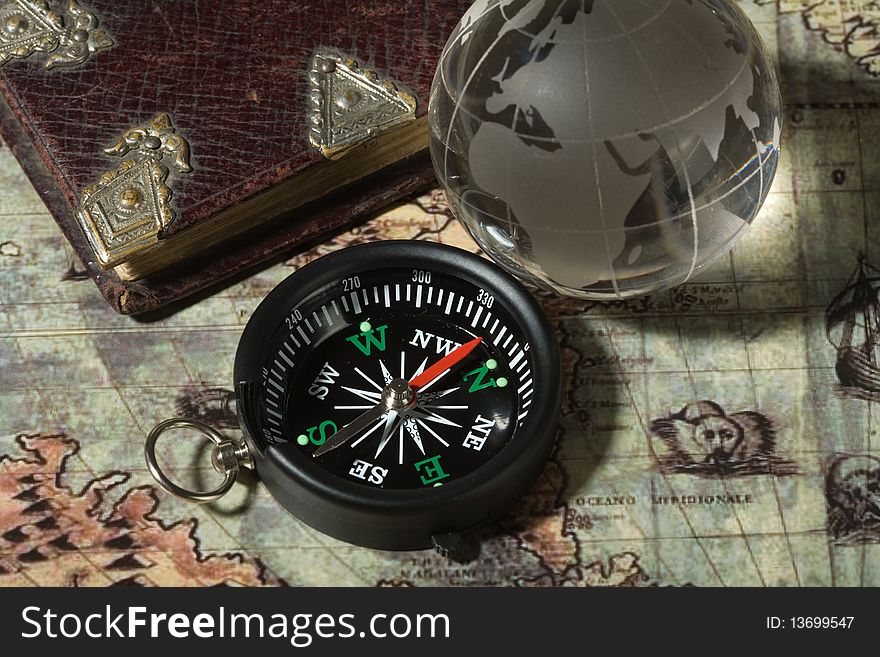 Compass on the old map. Concept travel.