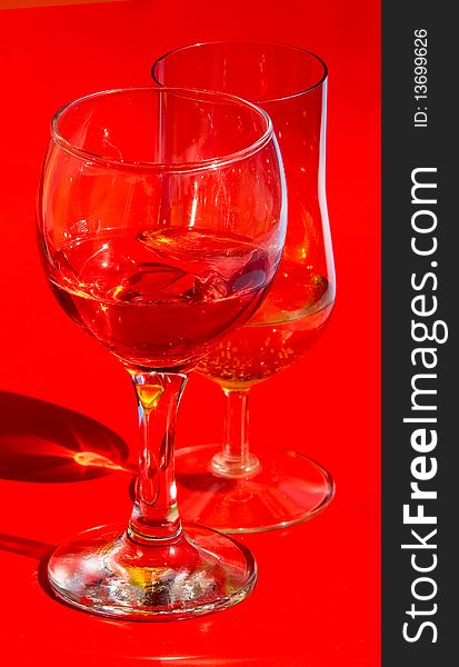 Red wine glass isolated on a blue background