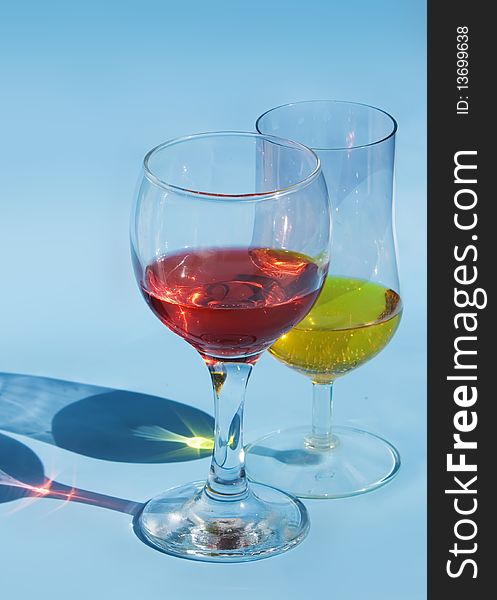 Red wine glass isolated on a blue background