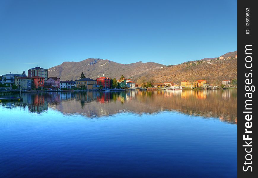 Reflection of a village on the lake