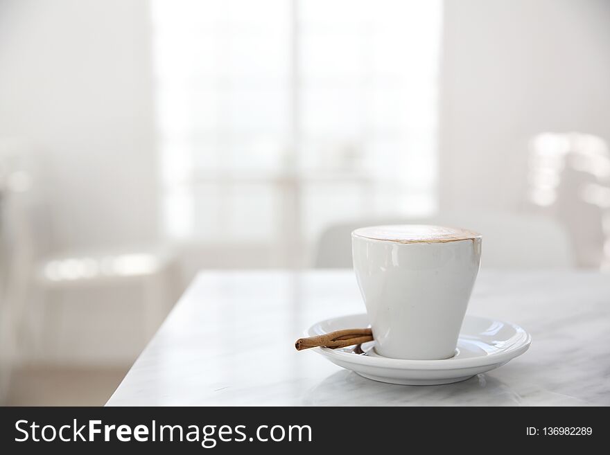 Cappuccino coffee on wooden table