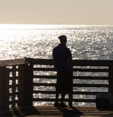 Fisherman At The Pier Royalty Free Stock Photos Fisherman At The Pier Royalty Free Stock Photos