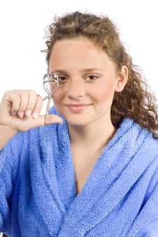 Young Woman Dressed Blue Bathrobe With Eyelash Curler Royalty Free Stock Images Young Woman Dressed Blue Bathrobe With Eyelash Curler Royalty Free Stock Images