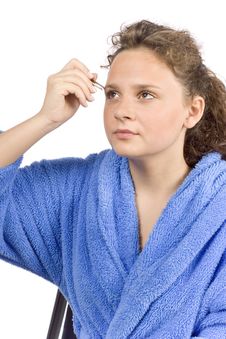 Young Woman Dressed Blue Bathrobe Using Tweezer Royalty Free Stock Images Young Woman Dressed Blue Bathrobe Using Tweezer Royalty Free Stock Images