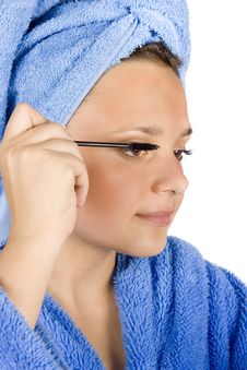 Young Woman Dressed Blue Bathrobe Putting Mascara Stock Images Young Woman Dressed Blue Bathrobe Putting Mascara Stock Images