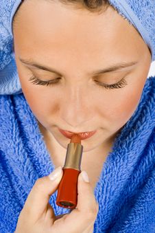 Young Woman Dressed Blue Bathrobe Putting Lipstick Royalty Free Stock Photography Young Woman Dressed Blue Bathrobe Putting Lipstick Royalty Free Stock Photography