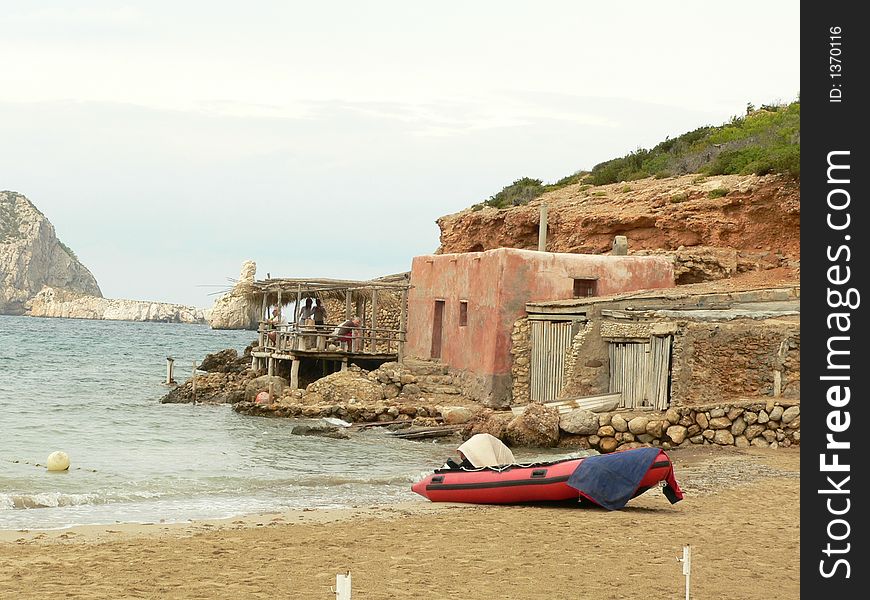 Sight of a small cove with traditional 1 floor buildings. Sight of a small cove with traditional 1 floor buildings.