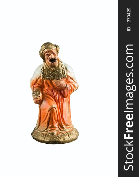 Orange wise man figurine from a nativity set. Orange wise man figurine from a nativity set