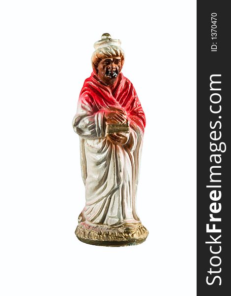 Red wise man figurine from a nativity set. Red wise man figurine from a nativity set