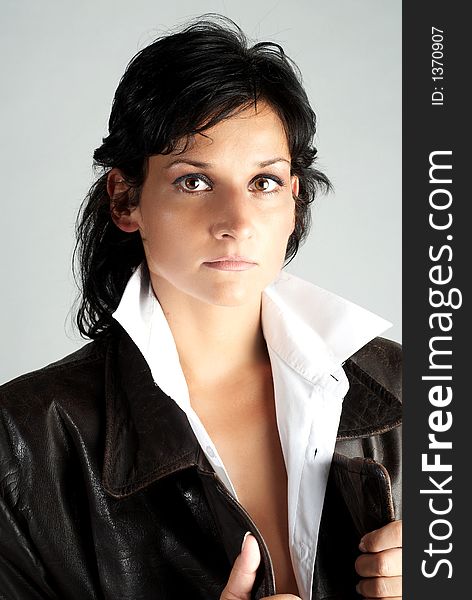 Portrait of beautiful woman in leather coat. Portrait of beautiful woman in leather coat