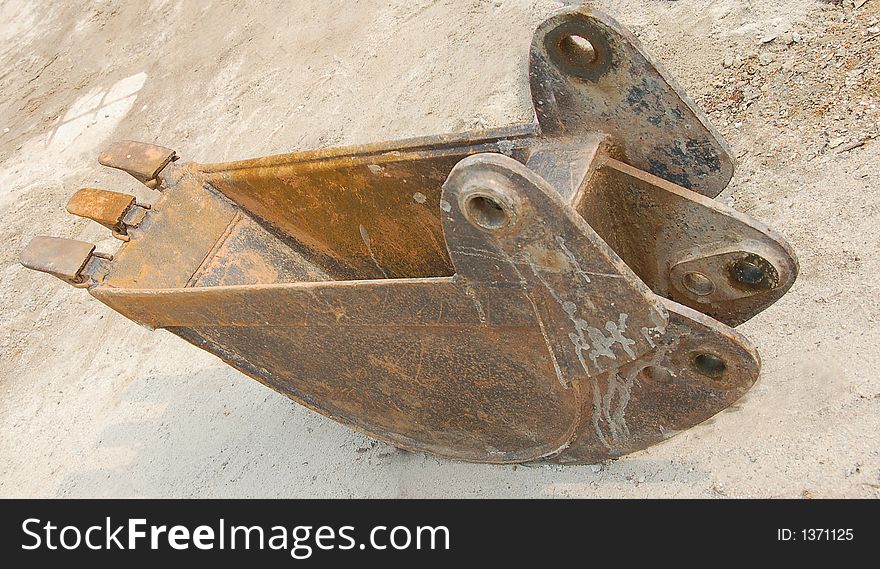 Bucket for backhoe showing narrow wide for cable laying