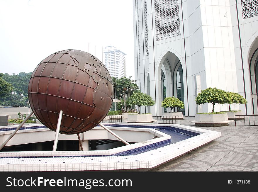 Globe infront a building showing america continent. Globe infront a building showing america continent