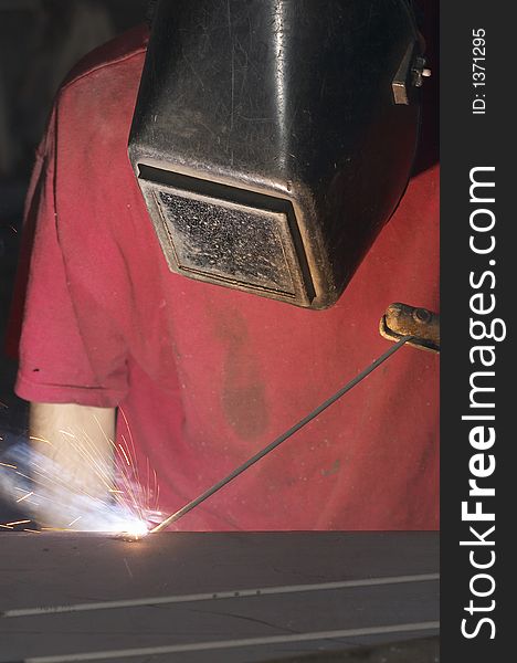 Close view of welder with red shirt. Close view of welder with red shirt