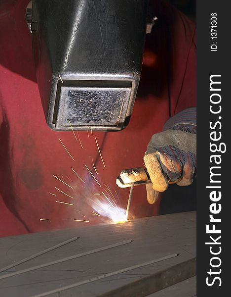 Close view of welder with red shirt. Close view of welder with red shirt