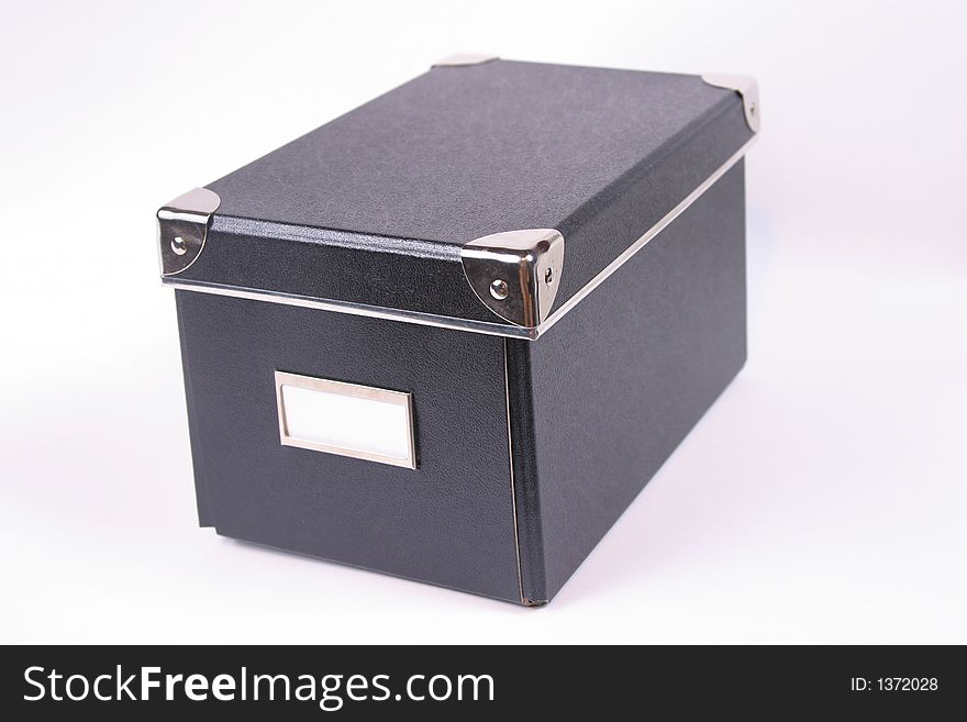 Image of a black box with a white label. Image of a black box with a white label.