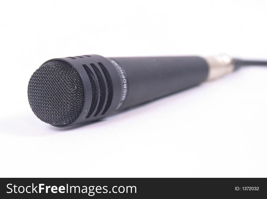 Isolated image of a black microphone.