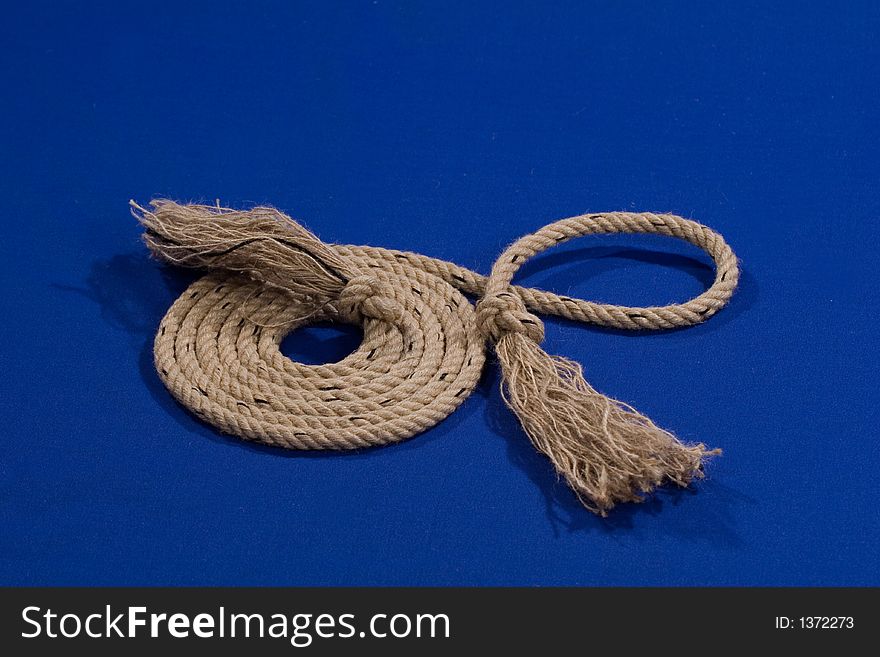 Convoluted boat rope on blue background